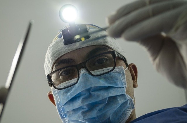 emergency dentist examining a patient
