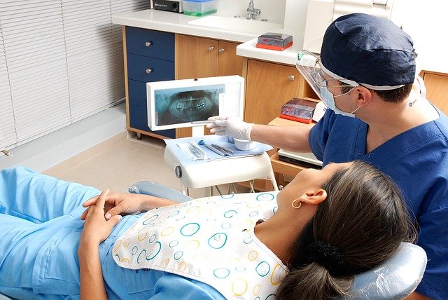 dentist explaining a root canal to a patient